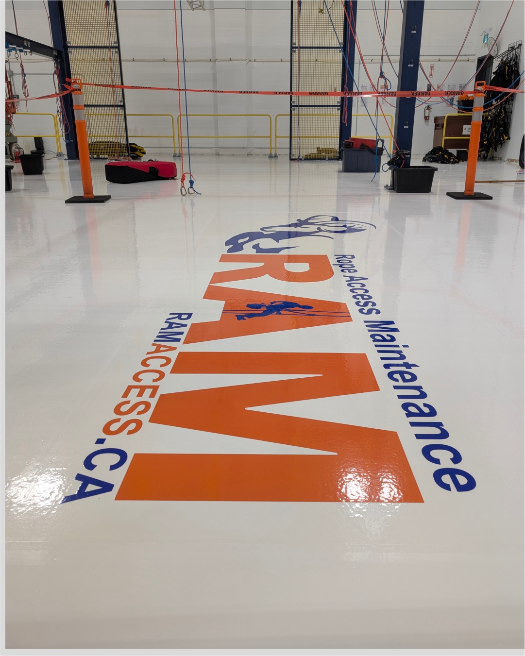 Custom industrial floor graphics and branding for RAM Access Maintenance facility in Burlington.