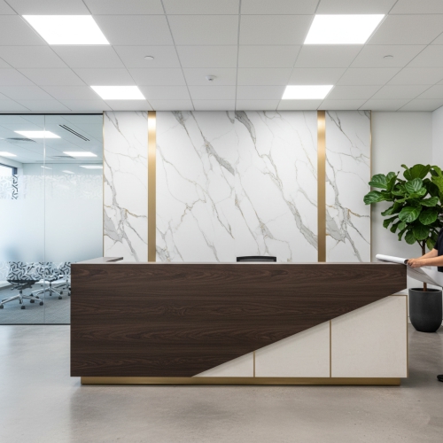 Architectural Surface Refinishing Oakville – Concept Graphics. Luxury commercial elevator lobby refinished in high-end wood grain architectural film in Burlington.